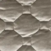 Quilted fabric texture in taupe features repeating hexagonal patterns with curved centers and angled folds, creating a soft, matte finish.